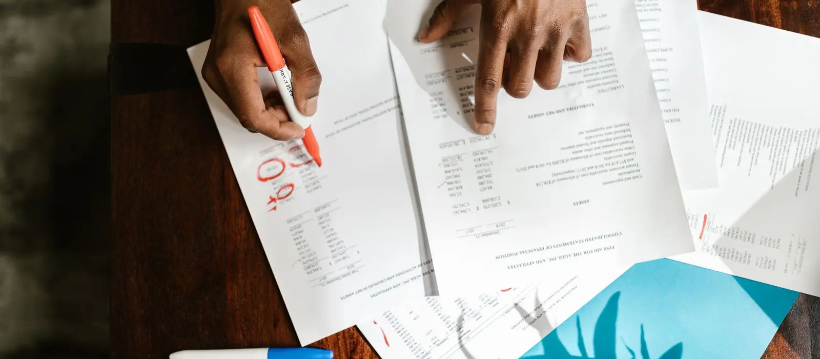 Accountant working through documents at a desk