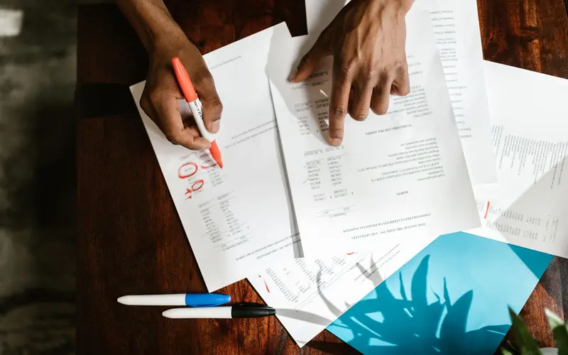 Accountant working through documents at a desk