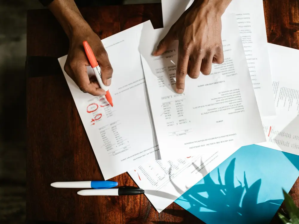 Accountant working through documents at a desk