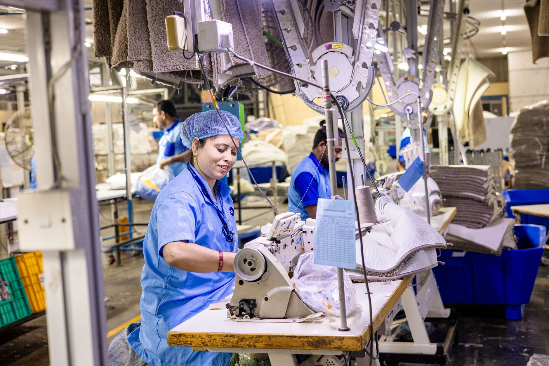 Workers on a small production floor