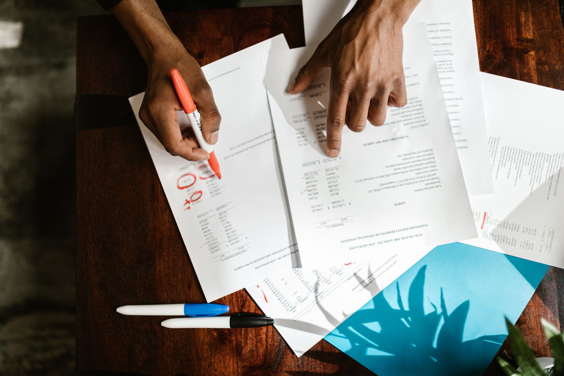 Accountant working through documents at a desk